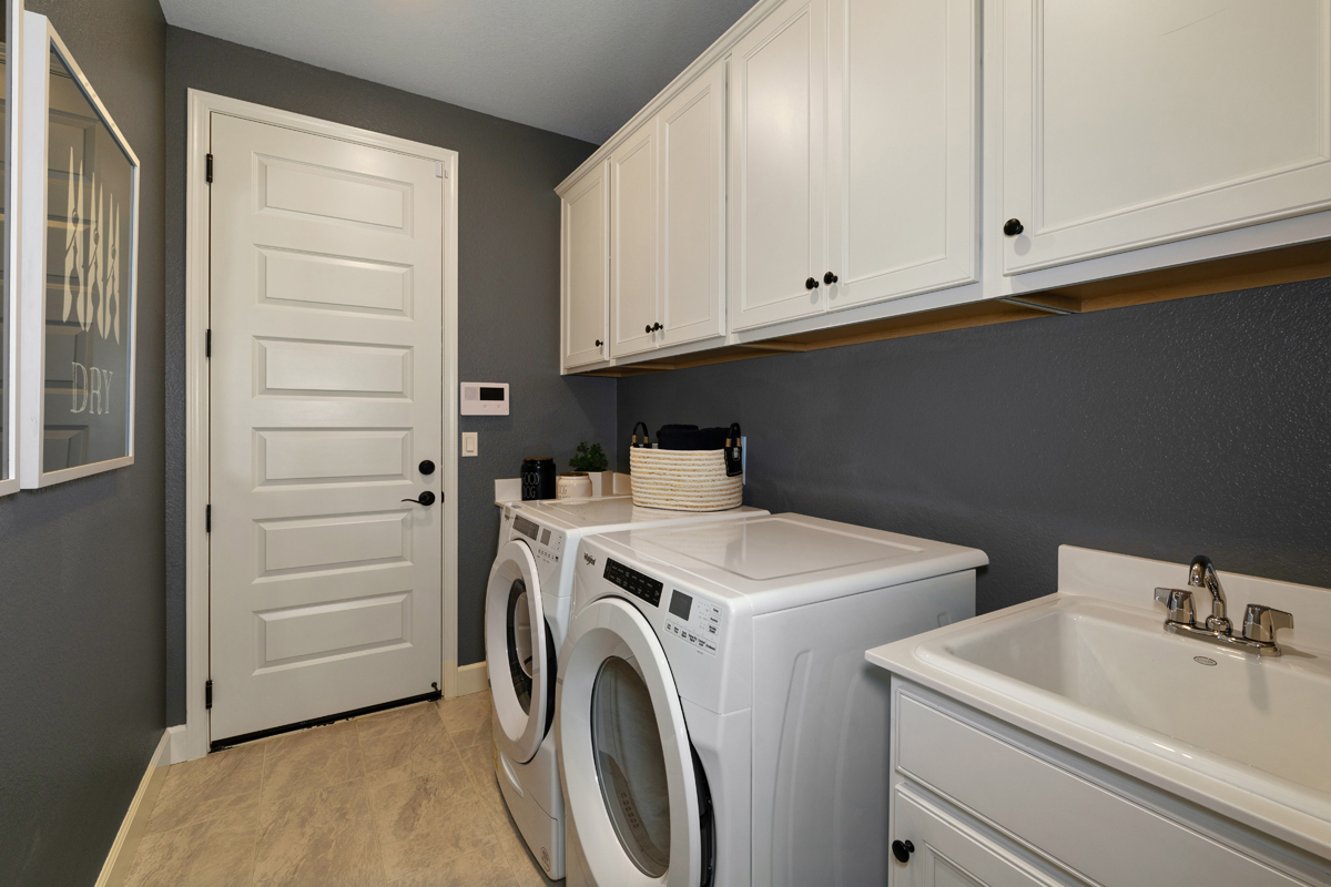 Cabinets and sink at laundry room