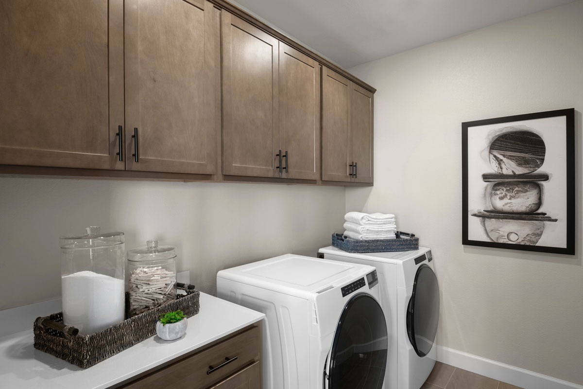 Dedicated laundry room with cabinets