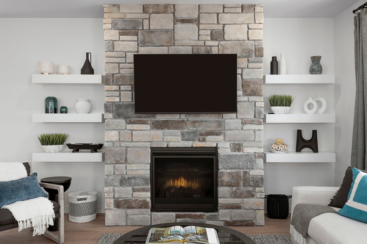 Gas fireplace with stone surround at great room