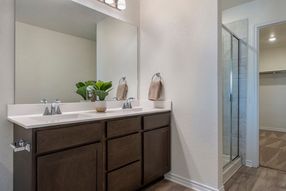 Raised dual-sink vanity at primary bath