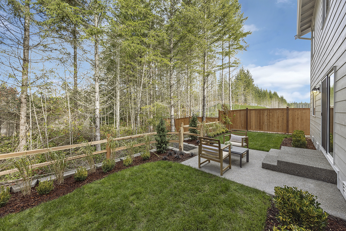 Landscaped and fenced backyard